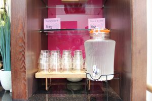 Water tank with reusable glasses. Both the water tank and the glasses are made of glass.