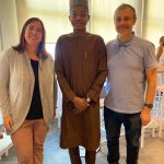 Muktar posing with two colleagues