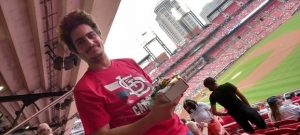 A person in the stands at a baseball game