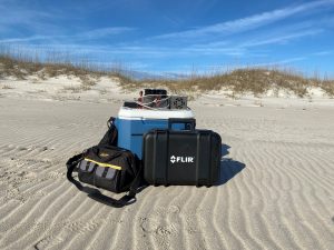 Scientific equipment positioned on a sandy beach