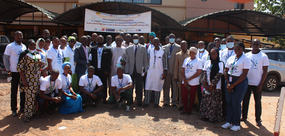 A group of researchers posing for a photo outside a conference centre