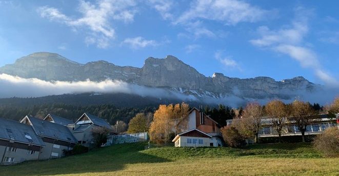 Chalets with mountains in the background